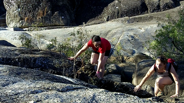 climbing over rocks