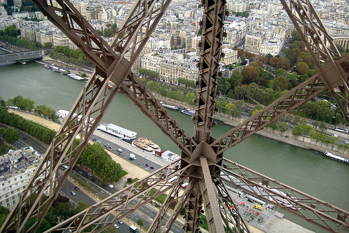 View of the Seine from inside the Eiffel Tower, Paris (courtesy wallyg at flickr CC)