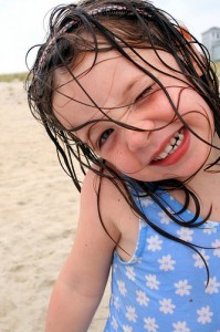 Beach girl on the North Carolina Outer Banks (courtesy Melle_Oh at Flickr CC)